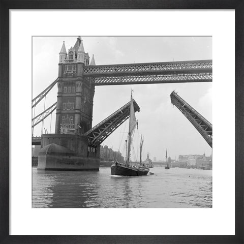 Tower Bridge open to allow the 'Sir Alan Herbert' to sail through