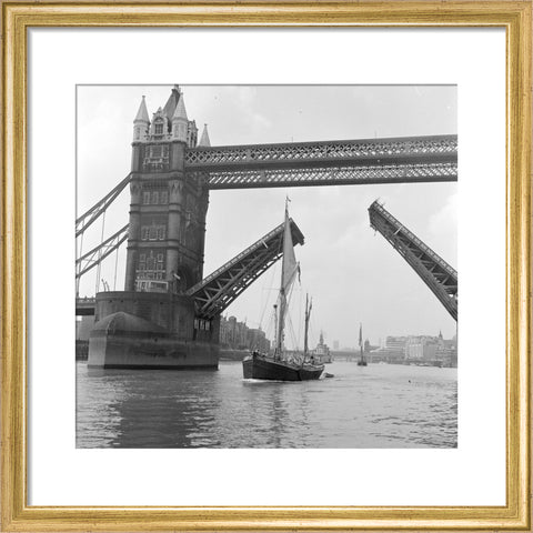 Tower Bridge open to allow the 'Sir Alan Herbert' to sail through