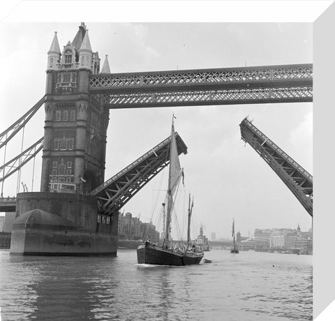 Tower Bridge open to allow the 'Sir Alan Herbert' to sail through
