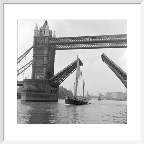 Tower Bridge open to allow the 'Sir Alan Herbert' to sail through