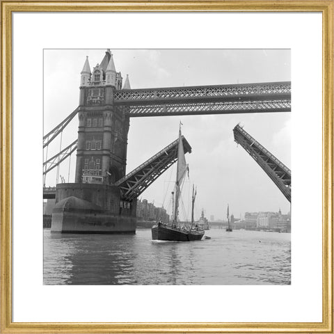 Tower Bridge open to allow the 'Sir Alan Herbert' to sail through