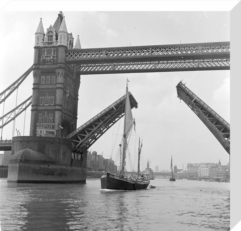 Tower Bridge open to allow the 'Sir Alan Herbert' to sail through
