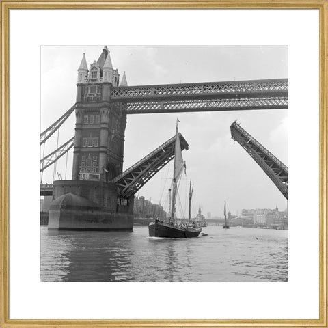 Tower Bridge open to allow the 'Sir Alan Herbert' to sail through