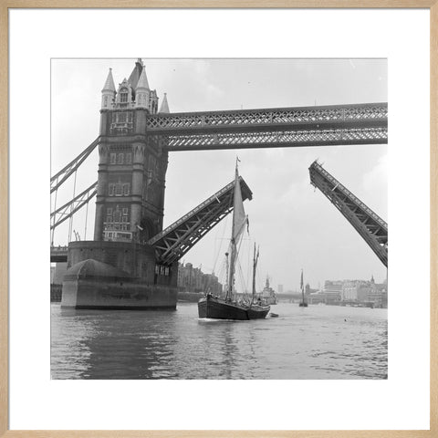 Tower Bridge open to allow the 'Sir Alan Herbert' to sail through
