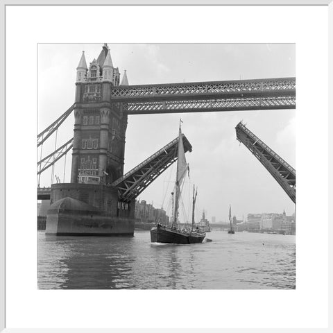 Tower Bridge open to allow the 'Sir Alan Herbert' to sail through