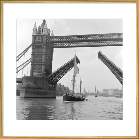 Tower Bridge open to allow the 'Sir Alan Herbert' to sail through
