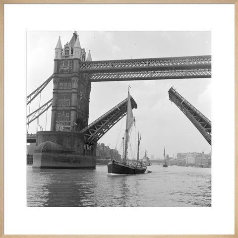 Tower Bridge open to allow the 'Sir Alan Herbert' to sail through