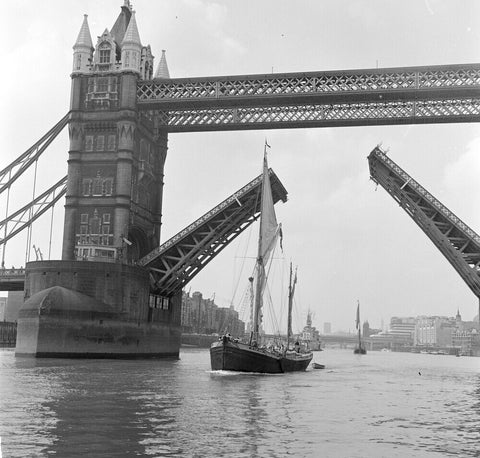Tower Bridge open to allow the 'Sir Alan Herbert' to sail through