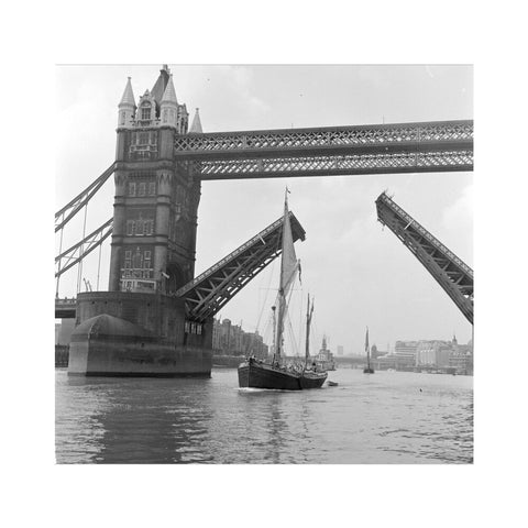Tower Bridge open to allow the 'Sir Alan Herbert' to sail through