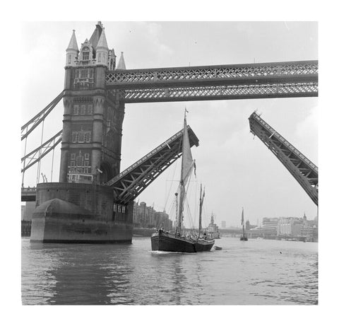Tower Bridge open to allow the 'Sir Alan Herbert' to sail through