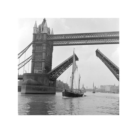 Tower Bridge open to allow the 'Sir Alan Herbert' to sail through