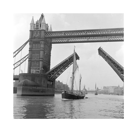 Tower Bridge open to allow the 'Sir Alan Herbert' to sail through