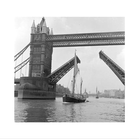 Tower Bridge open to allow the 'Sir Alan Herbert' to sail through