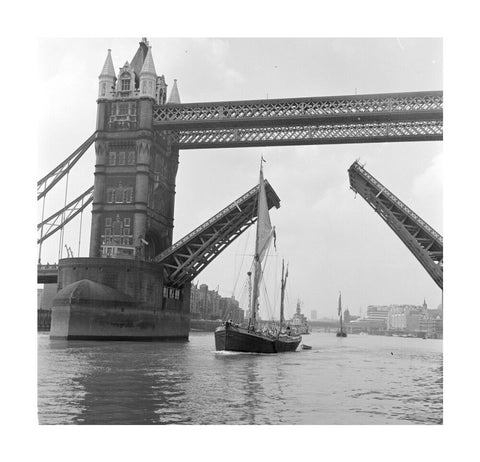 Tower Bridge open to allow the 'Sir Alan Herbert' to sail through