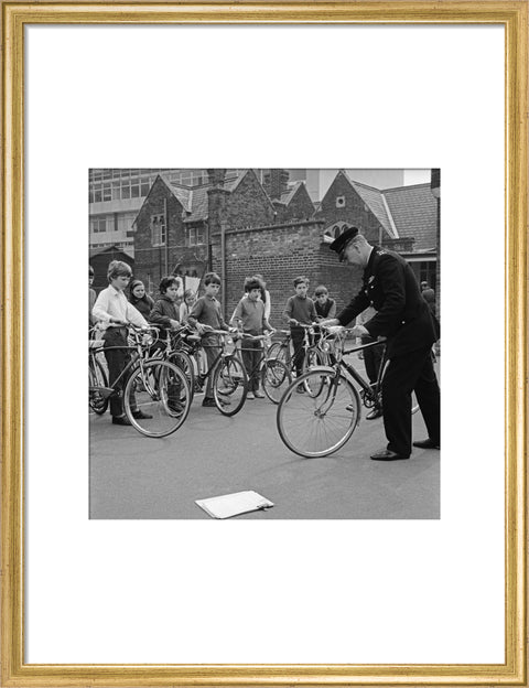 A policeman trains school children for their National Cycling Proficiency test at St. Mary's School, Finchley