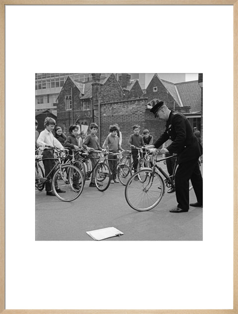 A policeman trains school children for their National Cycling Proficiency test at St. Mary's School, Finchley