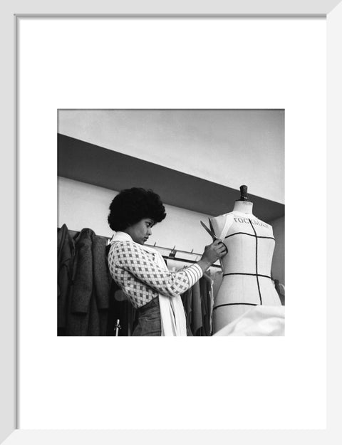 A female student works on a dressmaker's mannequin at Southgate Technical College