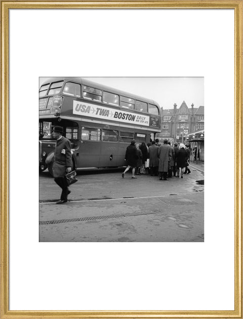 Commuters boarding a bus in Golders Green