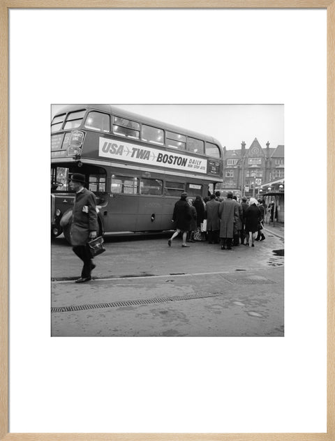 Commuters boarding a bus in Golders Green