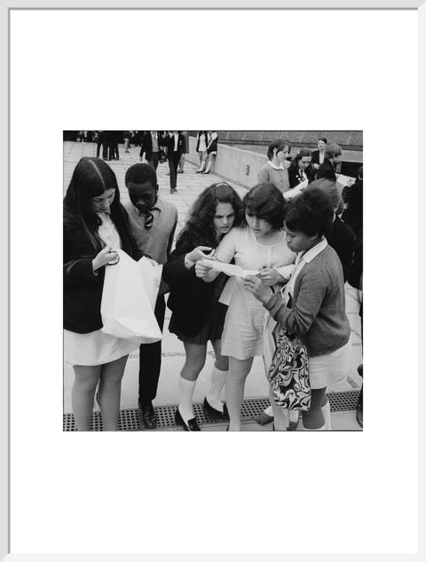 School girls receiving school reports or exam results
