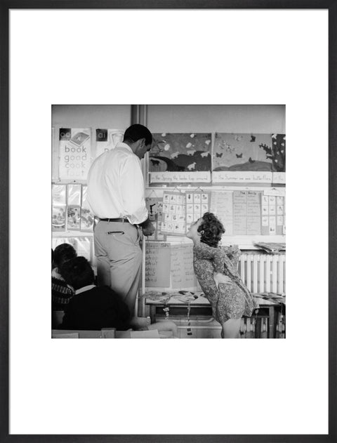 Girl sticking her tongue out at the teacher.