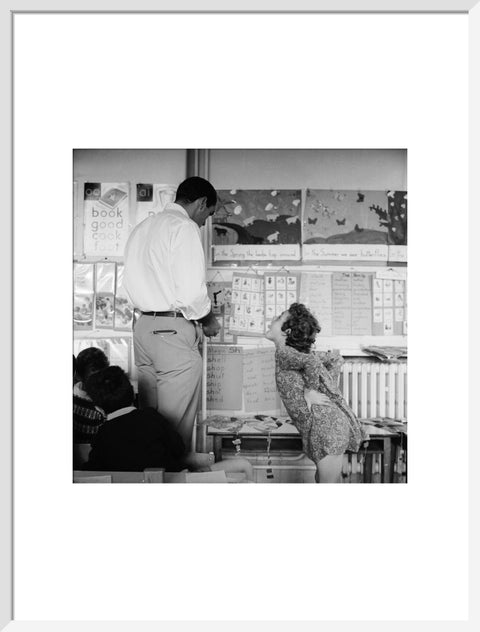 Girl sticking her tongue out at the teacher.