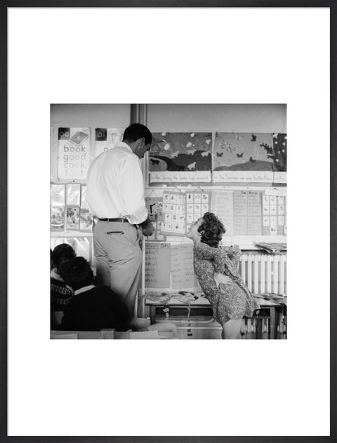 Girl sticking her tongue out at the teacher.
