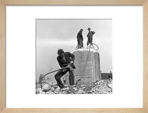 Three men working on a building site.