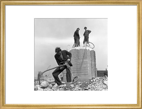 Three men working on a building site.