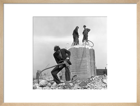 Three men working on a building site.