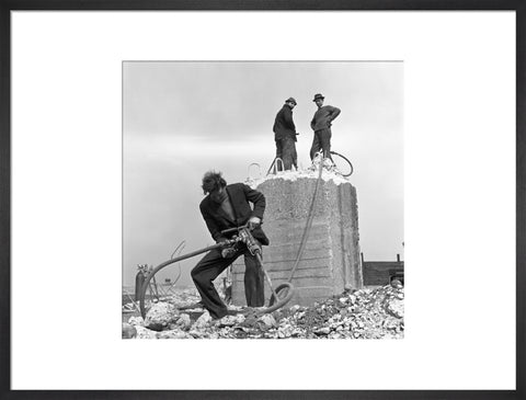 Three men working on a building site.