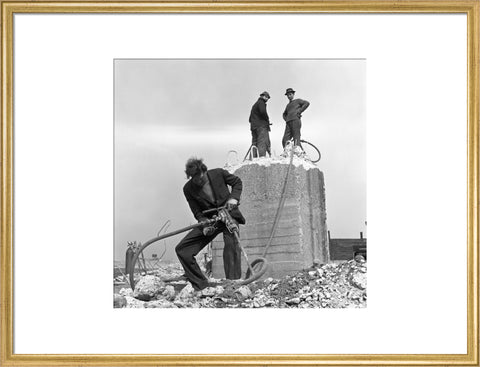 Three men working on a building site.