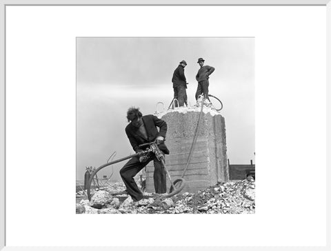 Three men working on a building site.