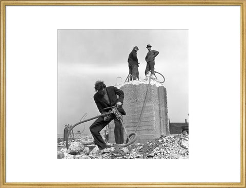 Three men working on a building site.