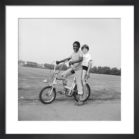 Two boys riding a bicycle 1973