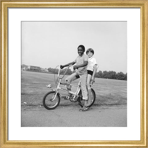 Two boys riding a bicycle 1973