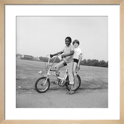 Two boys riding a bicycle 1973