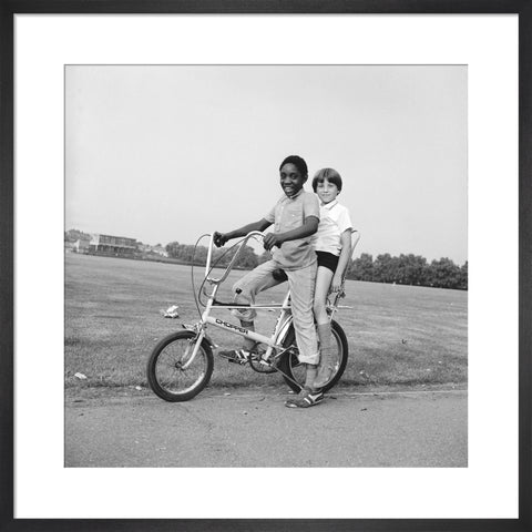 Two boys riding a bicycle 1973