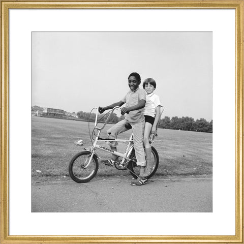 Two boys riding a bicycle 1973