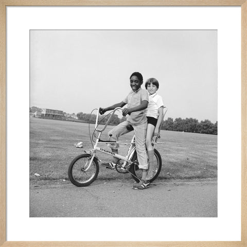 Two boys riding a bicycle 1973