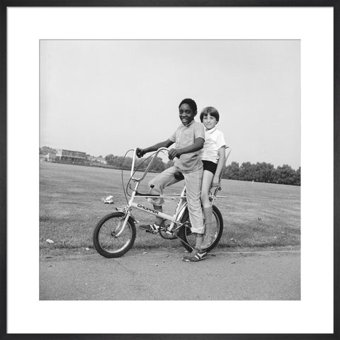 Two boys riding a bicycle 1973