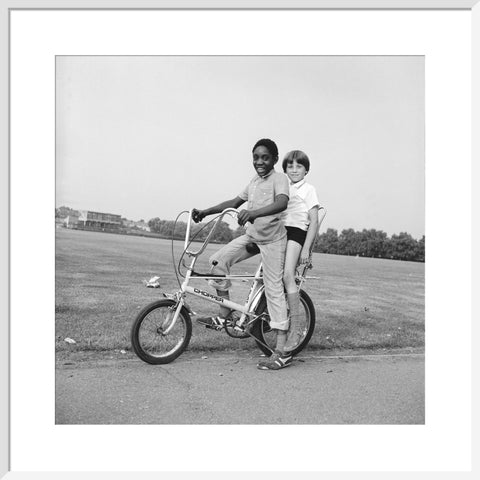 Two boys riding a bicycle 1973