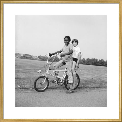 Two boys riding a bicycle 1973