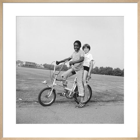 Two boys riding a bicycle 1973