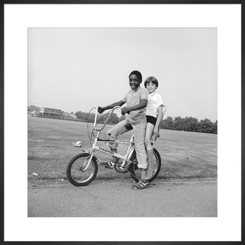 Two boys riding a bicycle 1973