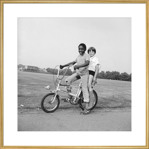 Two boys riding a bicycle 1973