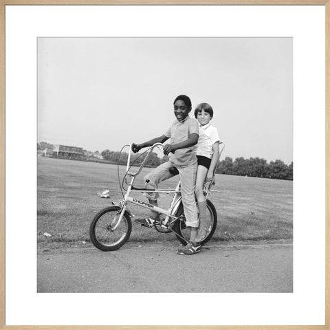 Two boys riding a bicycle 1973