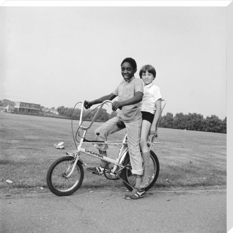 Two boys riding a bicycle 1973