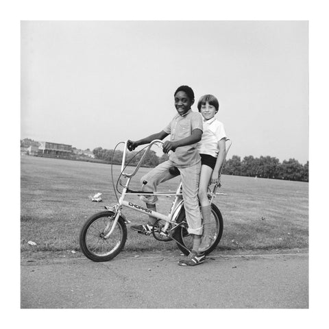 Two boys riding a bicycle 1973