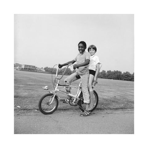 Two boys riding a bicycle 1973